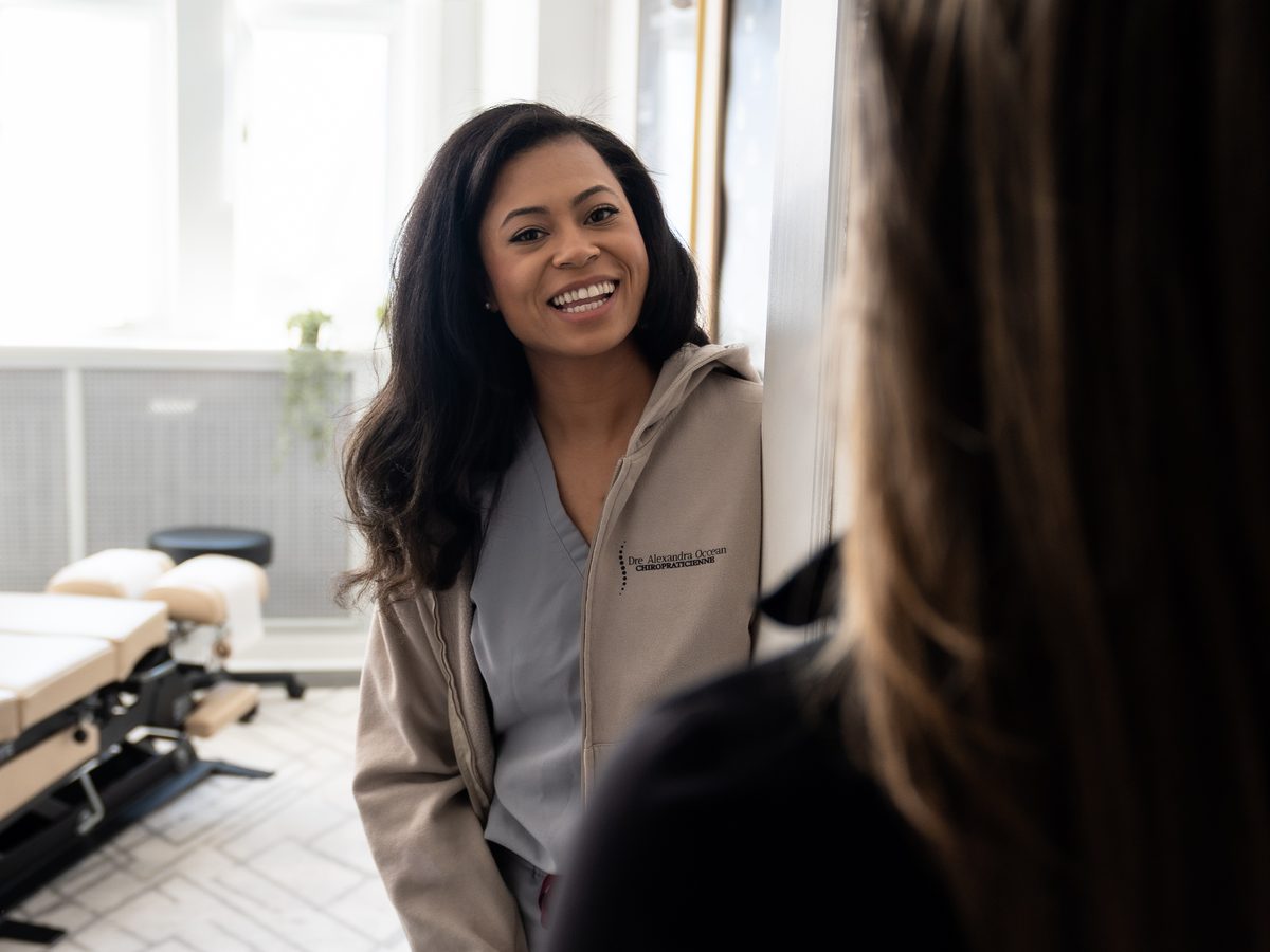 Dr. Alexandra Occean greeting a patient at the clinic door