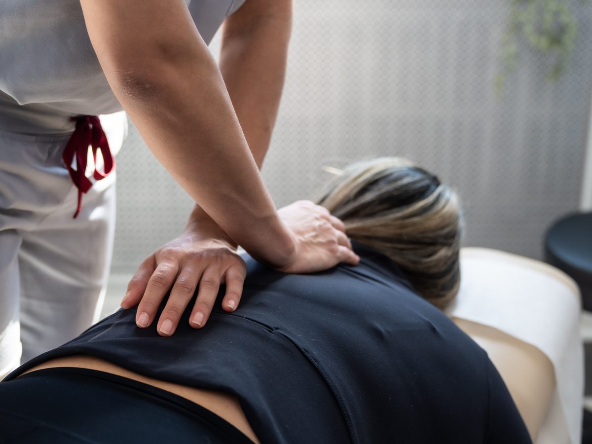 Dr. Alexandra Occean during a low back adjustment